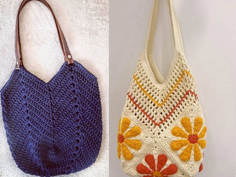 Duas bolsas de crochê, uma azul escura com alças de couro marrom e outra bege com detalhes florais coloridos.
